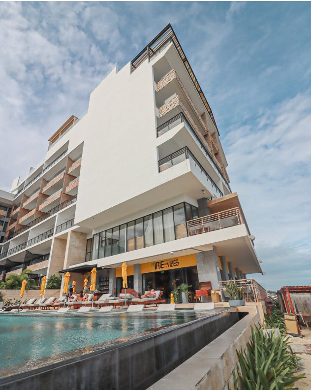 Oceanfront pool, loungers and beach view at RoMarley Beach House in Puerto Morelos, Mexico