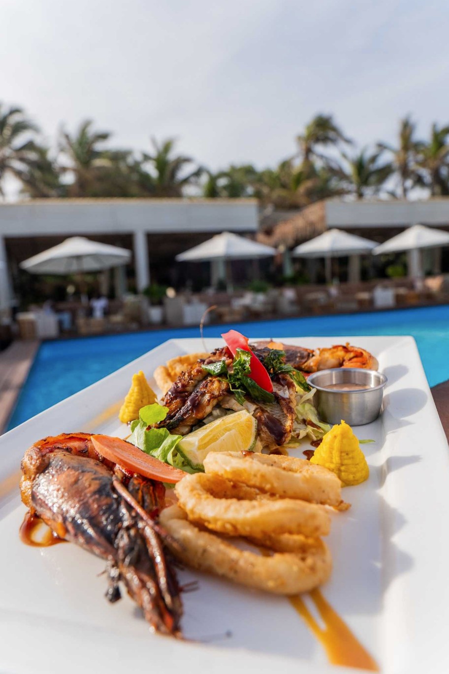 Cocktails and sunset view at Polo Beach Club