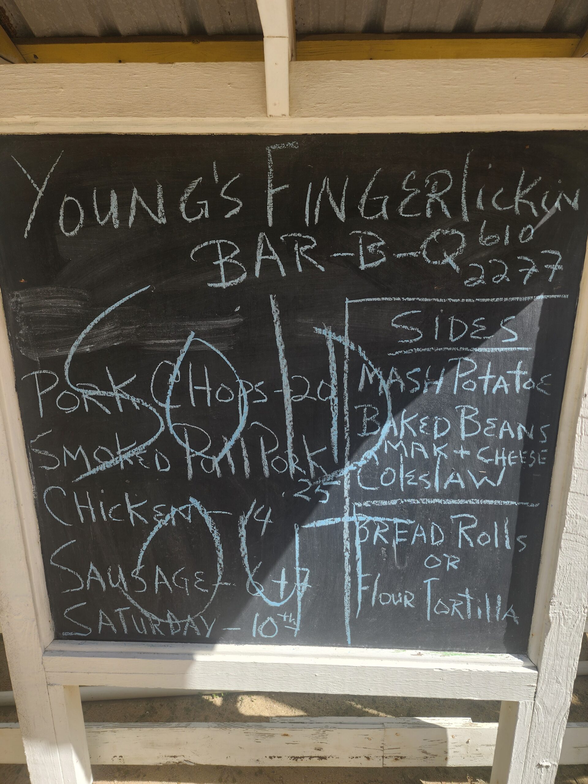 Chalkboard menu at Young’s Finger Lickin’ BBQ